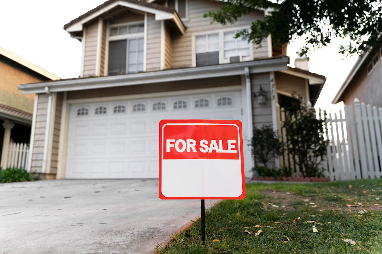 House with for sale sign