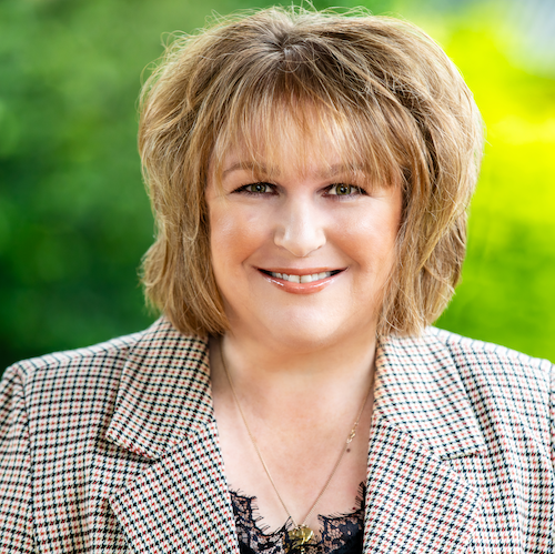 Professional portrait of a smiling female lawyer from Rafton Family Lawyers, specializing in compassionate family and divorce legal services in Sydney.
